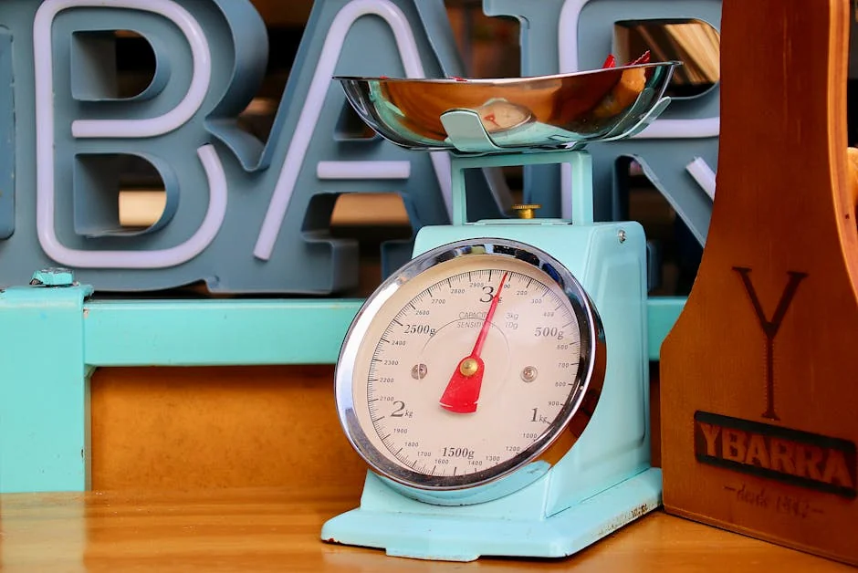 Close-up of a vintage blue kitchen scale with fruits in a modern setting. - best digital kitchen scales for precise baking