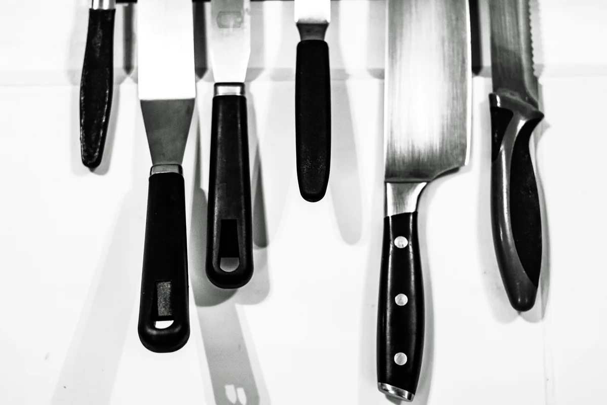 black knife lot - best kitchen knives for home chefs on a budget