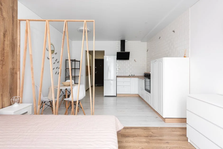 Spacious modern studio apartment featuring an open kitchen and minimalist decor. - best product reviews for small apartments