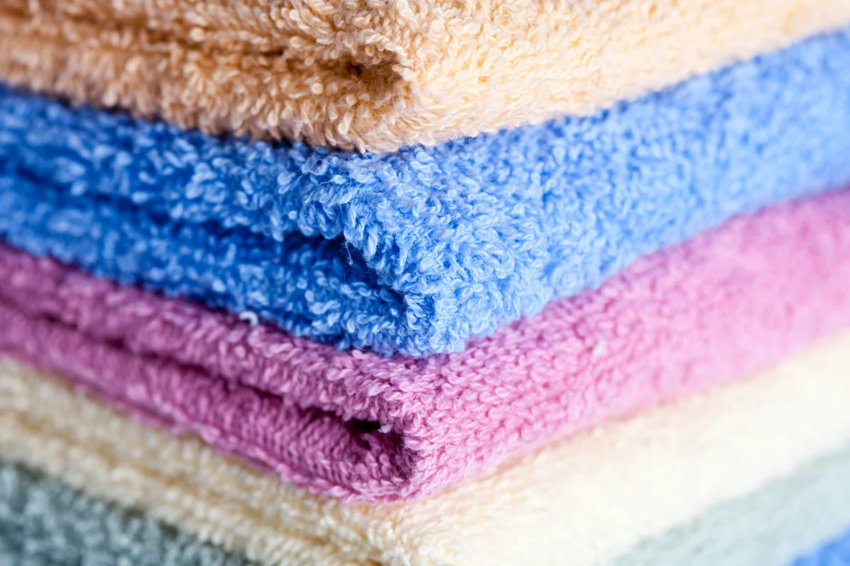 A stack of multicolored towels stacked on top of each other - most durable bath towels for everyday use
