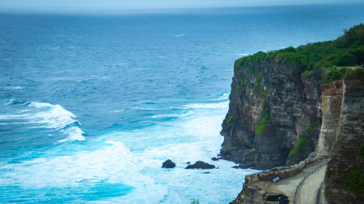 Rugged cliff overlooking a turbulent ocean with crashing waves. - adventure vacation destination - top rated handheld garment steamers for travel