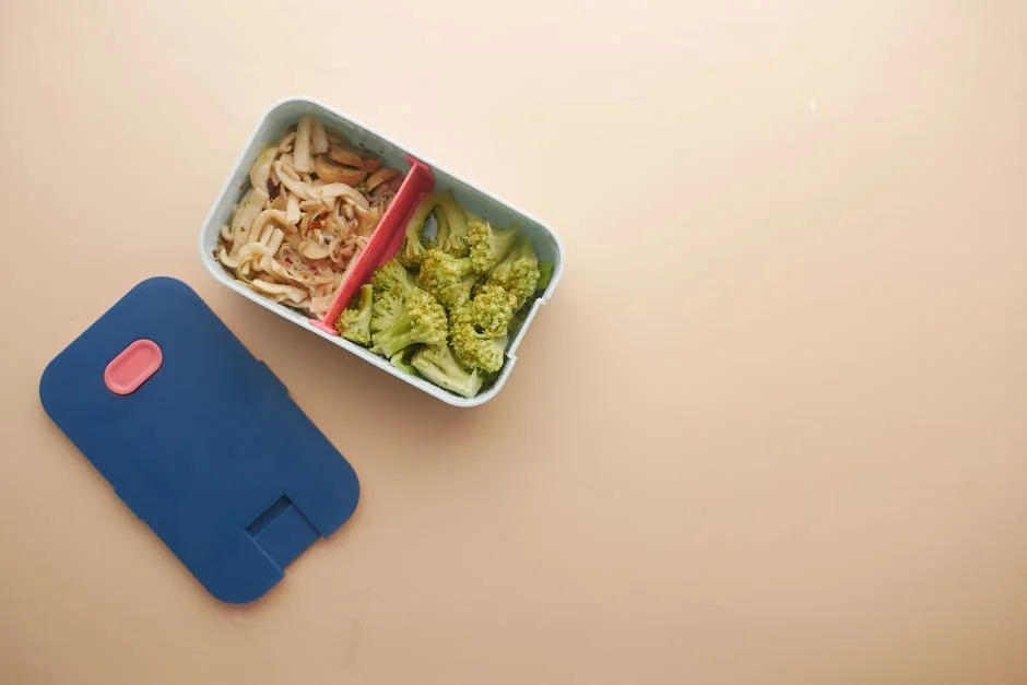 Top view of a bento box with broccoli and noodles, perfect for a healthy meal. - top rated meal prep containers for long term use