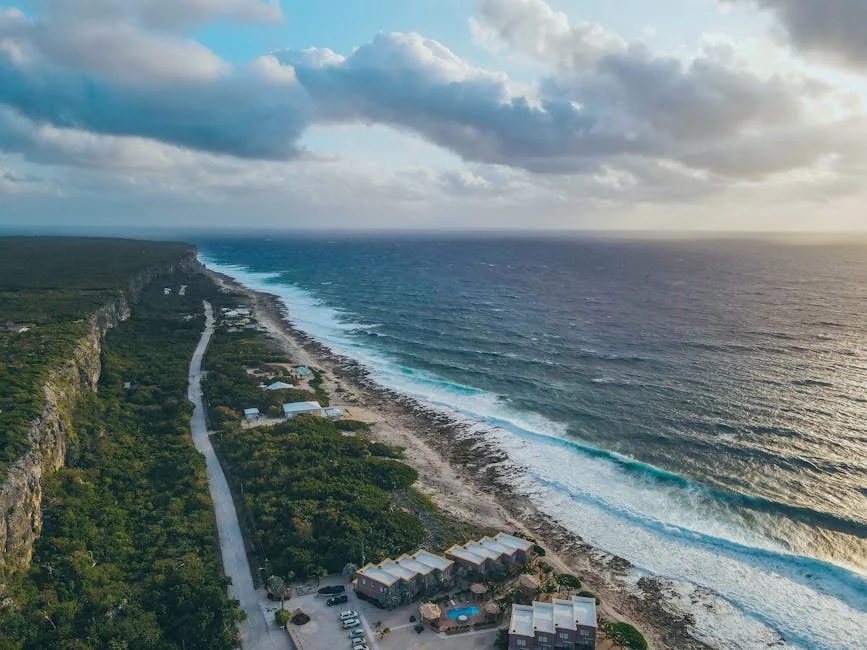 Stunning aerial view of Breakers coastline, Cayman Islands, capturing the ocean and beach. - adventure vacation destination - top rated portable power banks for travel