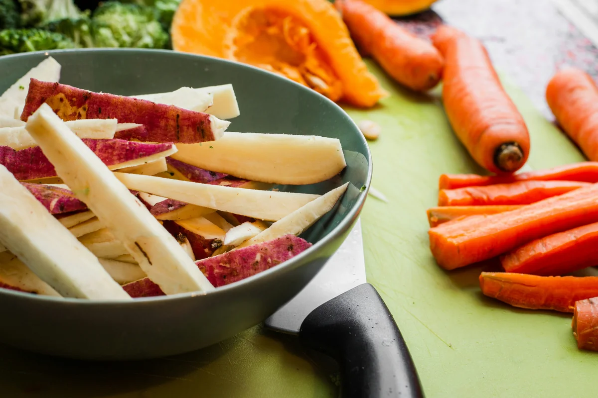 sliced vegetable on round grey bowl - top rated vegetable peelers for easy prep